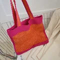 Handgefertigte Häkeltasche in Pink und Orange mit modernem Strickmuster und Netzdesign - Orange und Rosenrot