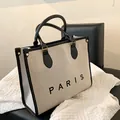 Bolso tote grande de lona beige con asas de cuero negro y estampado PARIS - L Negro