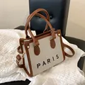 Bolso tote de lona y cuero marrón con letras de PARIS y detalles dorados - Marrón Pequeño