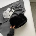 Chic black plush tote bag with braided leather handles and a long crossbody strap - Black