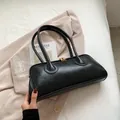 Minimalist black vintage shoulder bag in premium textured leather with gold zippers - Black