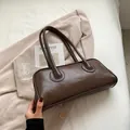 Brown faux leather shoulder bag with sleek rectangular design and long handles - Coffee
