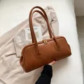 Vintage caramel brown matte leather tote bag with minimalist dual handles and gold zippers - Tan