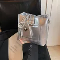 Silver bucket bag with pearl bow and heart charm, stylish metallic crossbody purse - With Pendant / Silver