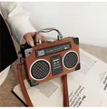 Vintage radio-shaped caramel brown leather handbag with metallic top handle and crossbody strap - Tan