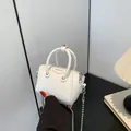 Mini white leather handbag for children with silver chain strap and top handle - White