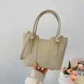 Elegant beige pebbled leather bucket bag with gold hardware for daily commuting - Beige