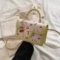 Piccola borsa quadrata bianco crema con stampa di ciliegie e chiusura a fiore oro - Giallo