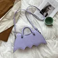 Lavender bat shaped PU leather crossbody handbag with spider web stitching detail - Violet