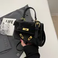Classic black velvet crossbody handbag with gold hardware and trapezoid shape - Black without Pendant