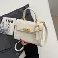 White leather handbag with 3D embossed patterns and golden metallic turn-lock closure - White Without Pendant