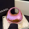 Pink metallic half-moon acrylic handbag with circular handle and gold chain strap - Pink