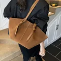 Deep brown faux suede tote bag for women featuring a minimalist knotted shoulder strap design - Brown