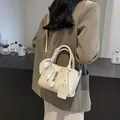 Cream bucket bag with decorative silk scarf handle and adjustable strap for women - White