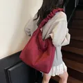 Retro burgundy canvas tote bag featuring pleated cloud shoulder strap and front pocket - Burgundy