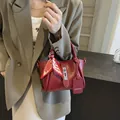Elegant dark red bucket handbag with decorative silk scarf and silver twist lock - Burgundy