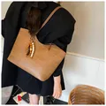 Brown woven tote bag with wooden bead charm and spacious commuter style for women - With Beaded Pendant / Khaki