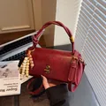 Retro dark red textured leather handbag with gold twist lock and wooden bead charm - With Charm / Burgundy