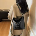 Classic black leather tote bag with silver hardware and adjustable shoulder strap - Black