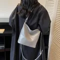 Minimalist light grey leather tote bag with FASHION & BAGS logo and crossbody strap - Silver