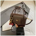 Retro dark brown glossy square handbag with gold logo and cherry pendant detail - With Cherry Pendant Style / Brown
