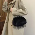 Elegant black faux fur shoulder bag with gold chain strap and metal lock closure - 22*10*14 / Black