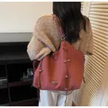 Detail of rust red suede tote bag with decorative drawstrings and silver beads detail - Burgundy