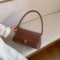 Braune Retro-Achseltasche aus Wildleder und Glattleder mit goldenem Metallverschluss - Braun