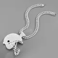 Macro shot of iced-out American football helmet pendant on heavy Cuban link chain - Football Helmet Pendant with Cuban Link Chain