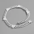 Macro shot of silver hip-hop Cuban chain necklace featuring five iced-out heart pendants - 20 Inch (50cm) / Silver