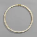 Vista dettagliata della collana tennis oro con zirconi rettangolari e chiusura a scatto sicura - Collana (45cm) / Oro