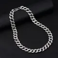 Macro detail of iced out Cuban link chain with sparkling rhinestones on a black background - Necklace / Size XL / Silver