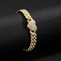 Macro shot of gold Cuban chain necklace featuring an iced-out heart centerpiece with clear crystals - Golden Bracelet (18cm)