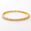 Gold tennis bracelet with round cubic zirconia stones on a clean white background - Gold / 7"