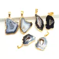 Macro view of natural geode pendants with irregular shapes and gold plated edges - Black Random