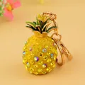Mini-Ananas-Schlüsselanhänger mit gelben Strasssteinen und goldenem Karabinerverschluss - Gelb