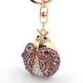 Porte-clés coccinelle étincelant avec cristaux violets et blancs sur métal doré - Violet