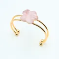 Detail of pink crystal flower petal double-ring gold-plated bracelet on white background - Rose Quartz