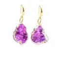 Close-up of raw purple druzy crystal earrings with gold plated frames and tassels - Rose Red