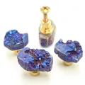 Detailed view of natural crystal cluster drawer knobs with brass bases and mounting screws - Blue