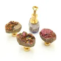 Detail view of pink crystal druzy drawer knobs with gold brass base and mounting screws - Orange Red