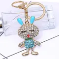 Portachiavi con coniglio scintillante in lega dorata e strass blu per borse da donna - Coniglietto / Blu