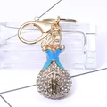 Sparkling money bag keychain with white crystals and dollar sign on glass base - Lucky Bag Style