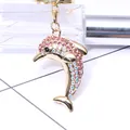 Goldener Delfin Schlüsselanhänger mit rosa Strasssteinen und Karabinerverschluss - Rosa
