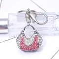 Roze kristallen handtas sleutelhanger met zilveren ring en een karabijnsluiting - Zilver
