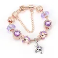 Bracciale con unicorno oro rosa con cristalli viola e ciondoli luccicanti - 17cm / Oro rosa