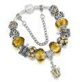 Bracciale a serpente d'argento con perline di vetro giallo e ciondoli a corona - 16cm / Giallo