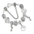 Bracciale con ciondoli placcato argento con impronte di cane e ossa su catena snake - 16cm / Bianco