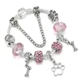 Bracciale a catena serpente argentato con perle di cristallo rosa e ciondoli zampa - 16cm / Rosa