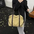 Fashion canvas tote bag with brown leather handles for versatile daily commuting use - Khaki